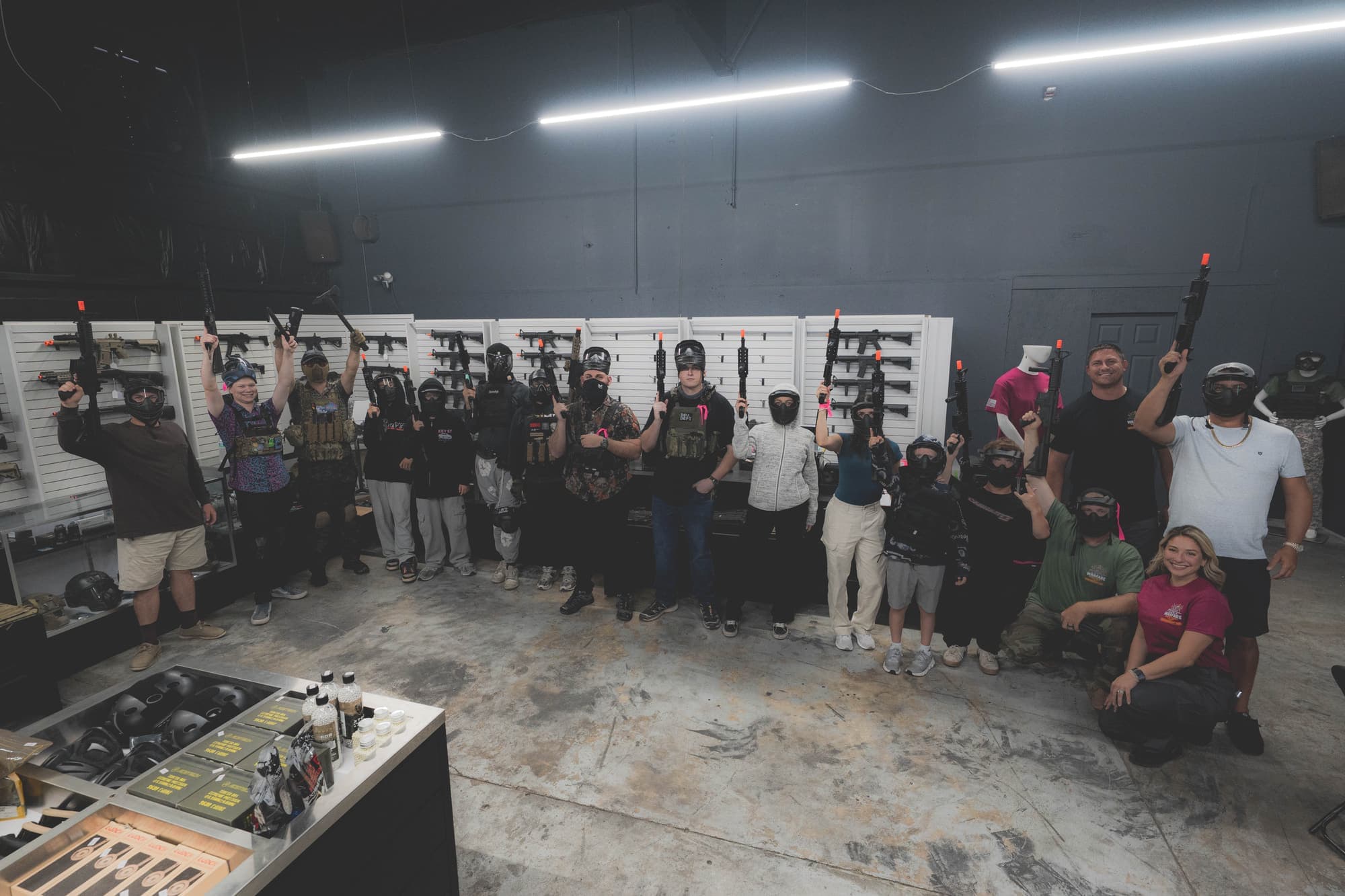 Large group of players posing together in the Warfare Airsoft lobby